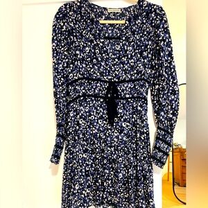 Ulla Johnson rich blue pattern dress with cinched waist.